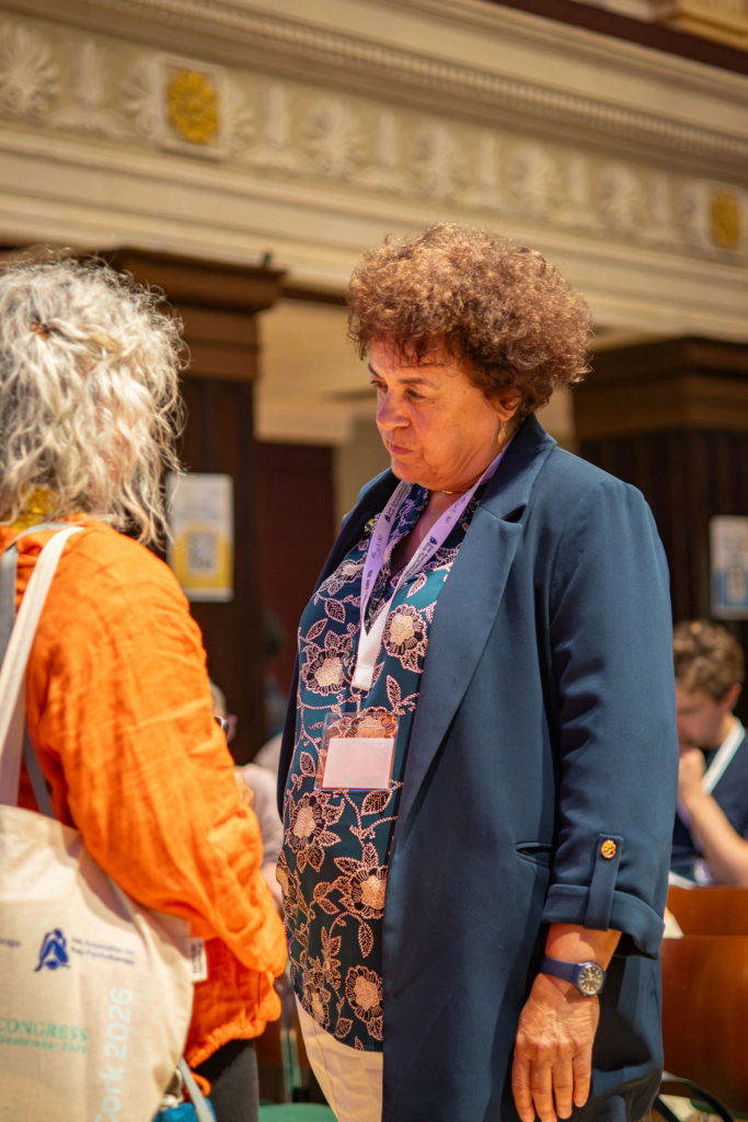 Attendees discussing and networking during a professional congress and corporate conference break.