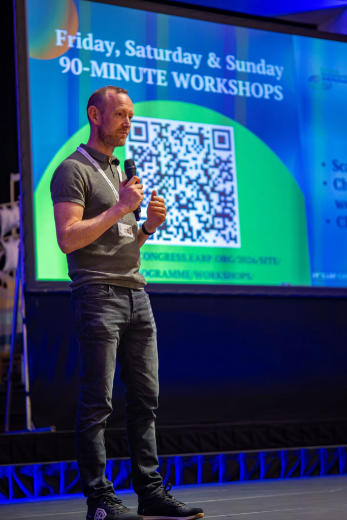 Corporate photography capturing engaging speaker presentations at a business seminar and summit event.