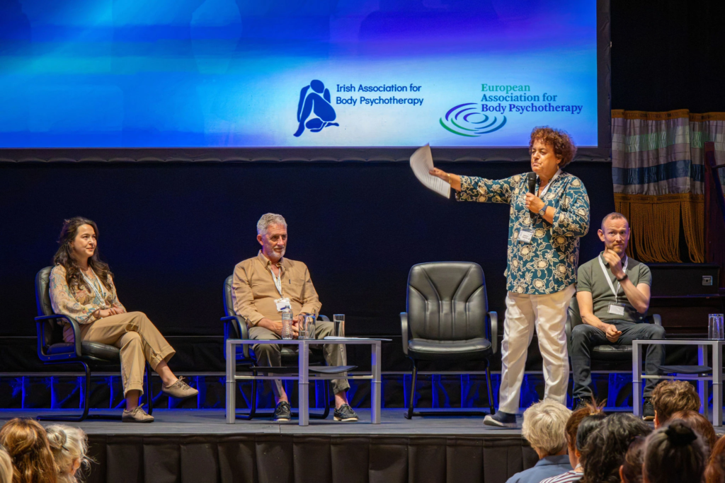 Keynote speaker presenting at an international medical or professional congress captured by a corporate event photographer.